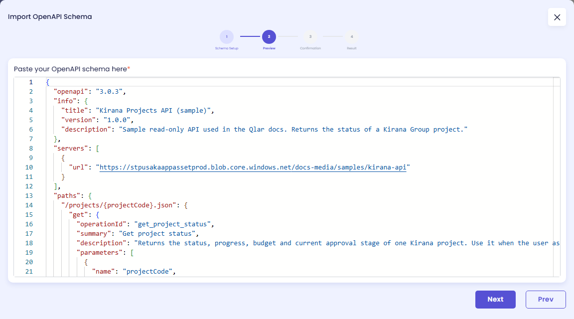 Preview step with the Paste your OpenAPI schema here editor showing the Kirana Projects API (sample) JSON: openapi 3.0.3, the info block, the servers URL https://stpusakaappassetprod.blob.core.windows.net/docs-media/samples/kirana-api and the start of the /projects/{projectCode}.json path with operationId get_project_status, and the buttons Next and Prev