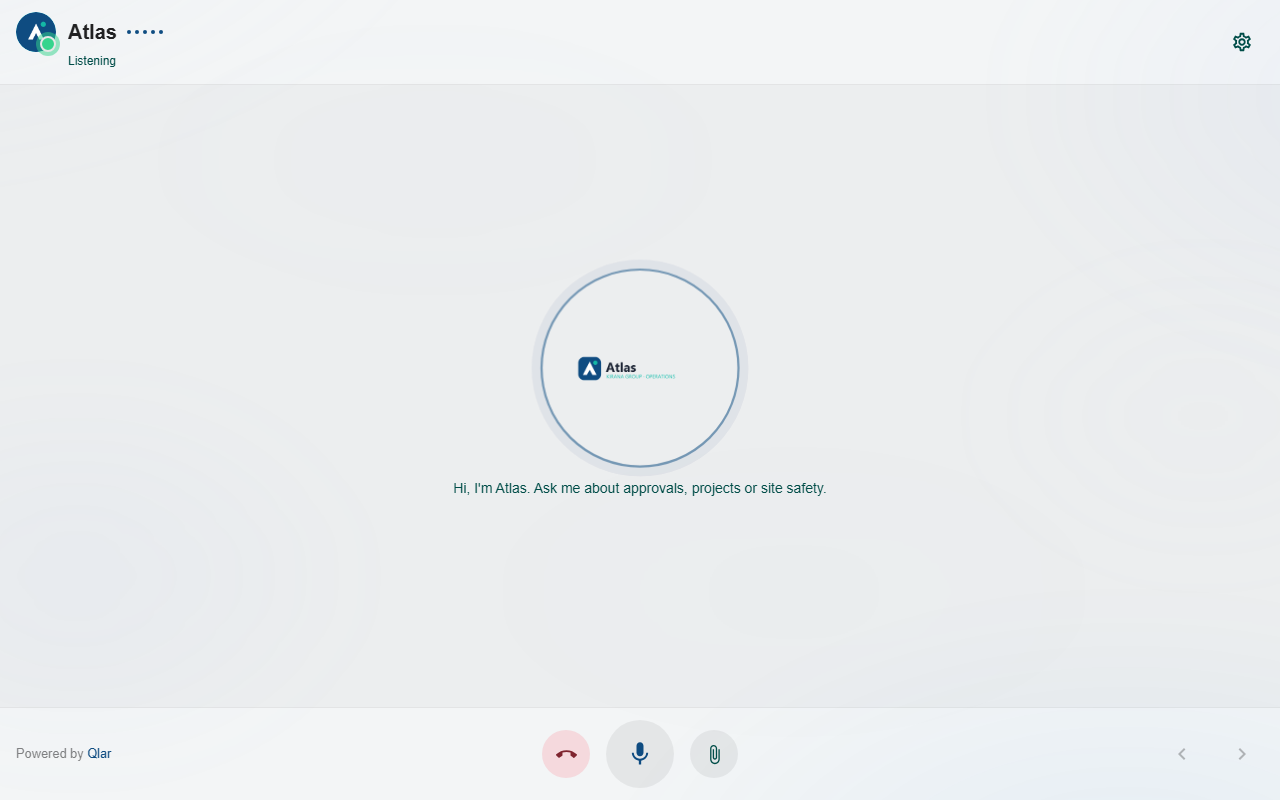 Immersive voice call with Atlas: the header shows the Atlas logo and name with the status Listening and a settings button, the center shows the Atlas Kirana Group Operations logo in a circle with the line Hi, I'm Atlas. Ask me about approvals, projects or site safety. below it, and the bottom bar shows Powered by Qlar, the end call, microphone and attach buttons, and previous and next page arrows